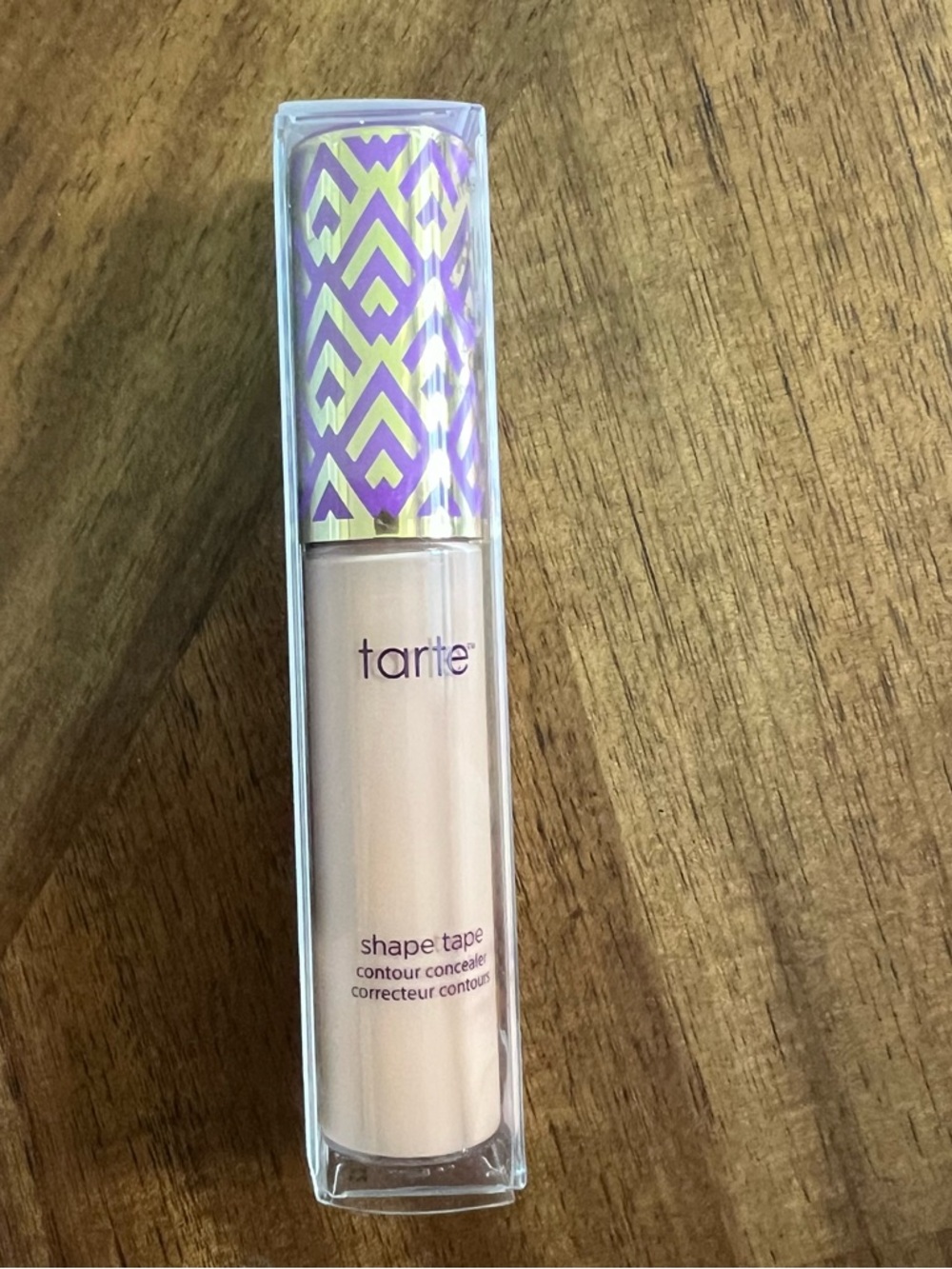 tarte concealer with lavender and gold patterned cap light medium honey